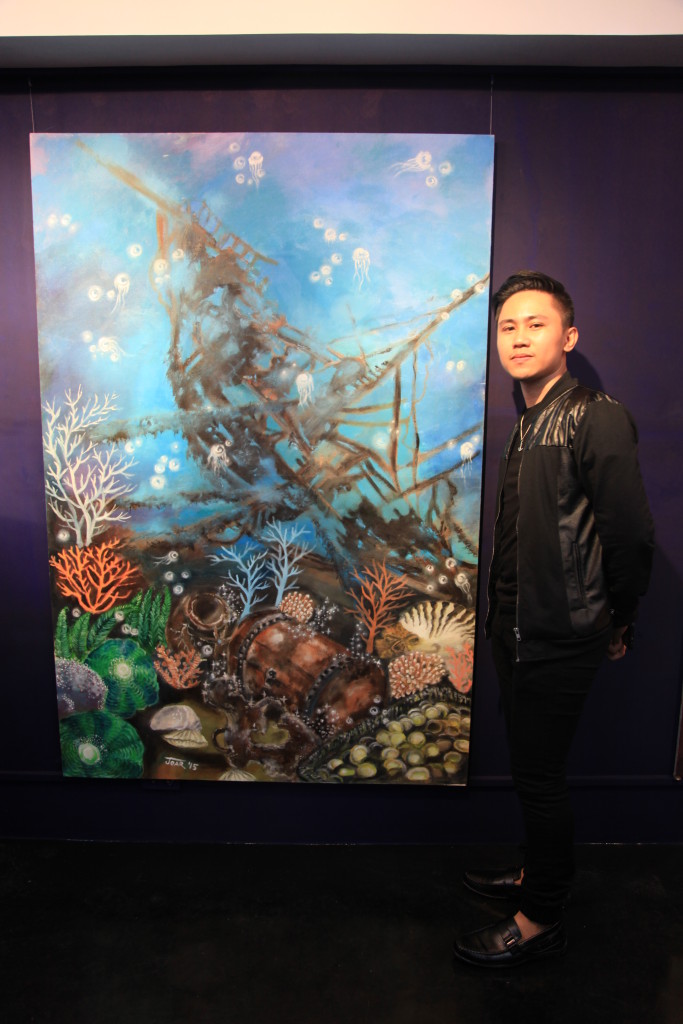 Joar Unabia with his artwork during the launching of ART DECK and his first solo exhibition Sea, Sailor and Solitude.